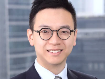 邹镇隆，通商律师事务所与周俊轩律师事务所联营（通商香港）